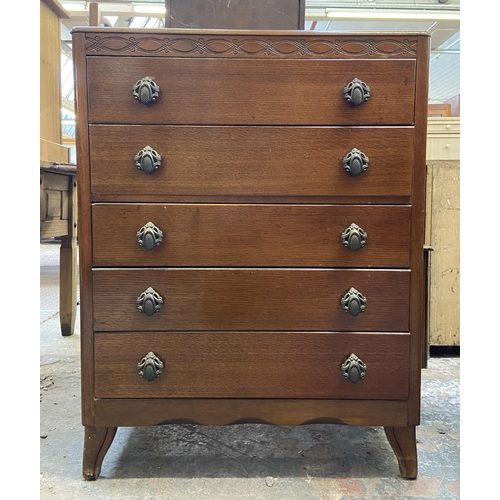 58 - A Lebus carved oak chest of drawers - approx. 101cm high x 77cm wide x 41cm deep