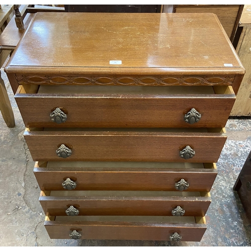 58 - A Lebus carved oak chest of drawers - approx. 101cm high x 77cm wide x 41cm deep