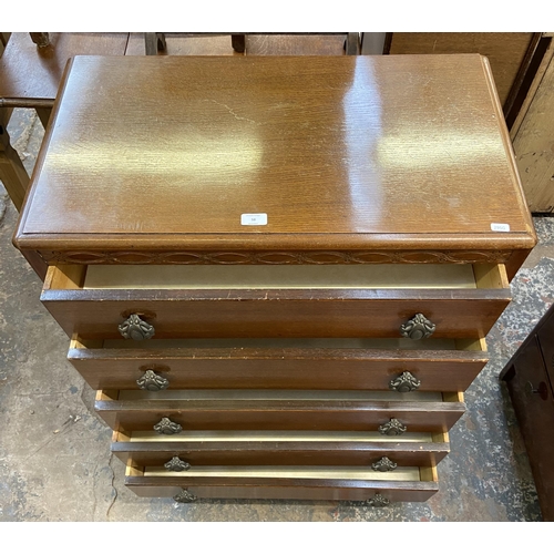 58 - A Lebus carved oak chest of drawers - approx. 101cm high x 77cm wide x 41cm deep