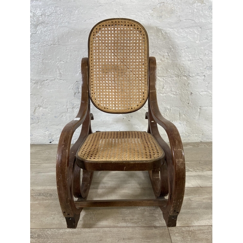 59 - A Thonet style bentwood and rattan child's rocking chair - approx. 70cm high x 36cm wide x 60cm deep