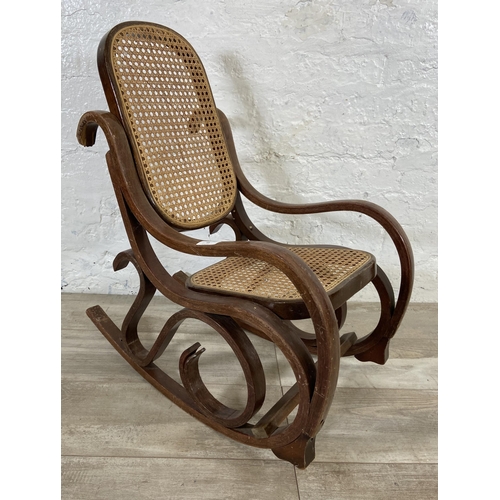 59 - A Thonet style bentwood and rattan child's rocking chair - approx. 70cm high x 36cm wide x 60cm deep