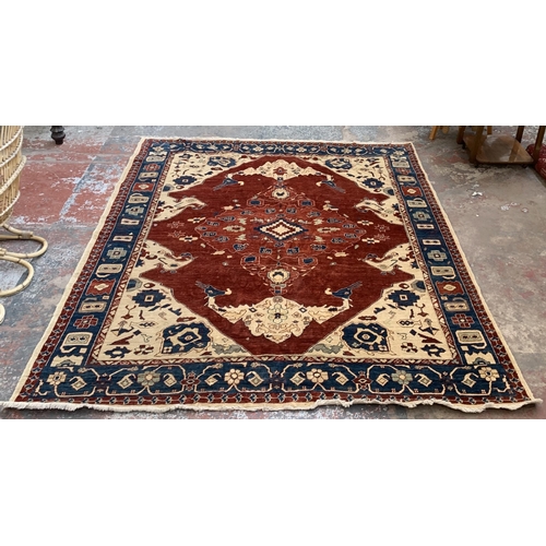 6 - An Iranian Heriz hand woven 100% wool pile rug - approx. 295cm x 247cm