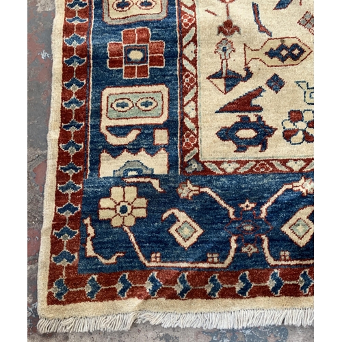 6 - An Iranian Heriz hand woven 100% wool pile rug - approx. 295cm x 247cm