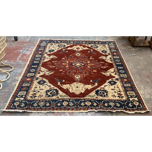 6 - An Iranian Heriz hand woven 100% wool pile rug - approx. 295cm x 247cm