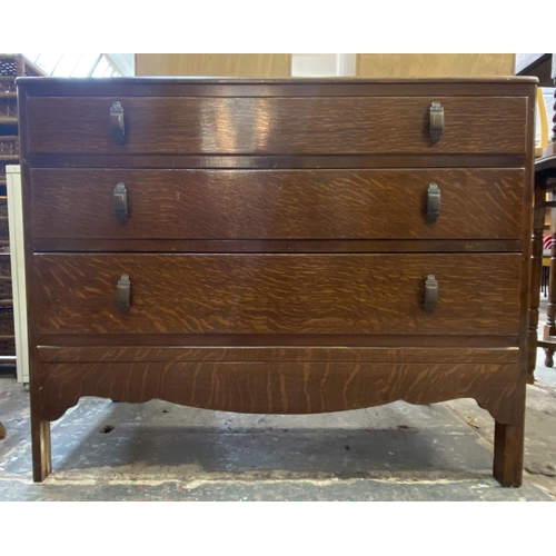 60 - A mid 20th century oak chest of drawers - approx. 75cm high x 91cm wide x 47cm deep