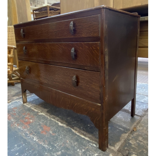 60 - A mid 20th century oak chest of drawers - approx. 75cm high x 91cm wide x 47cm deep