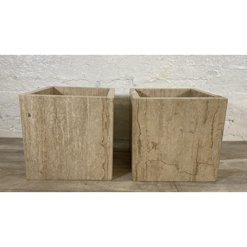 64 - Two travertine coffee table bases