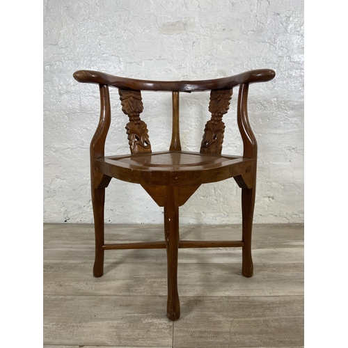 7 - An Oriental carved hardwood corner chair - approx. 71cm high x 62cm wide x 52cm deep