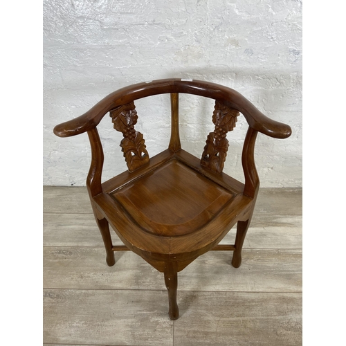 7 - An Oriental carved hardwood corner chair - approx. 71cm high x 62cm wide x 52cm deep