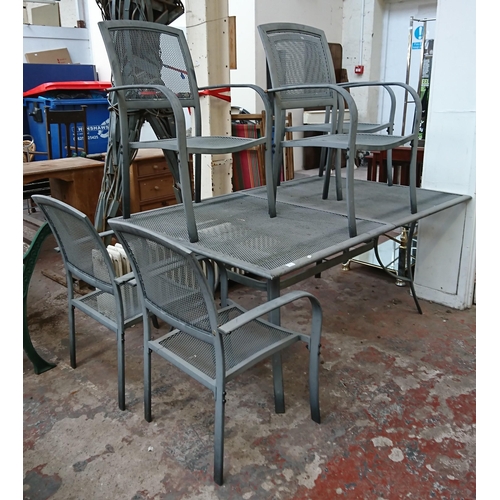 84 - A grey metal six piece patio set comprising rectangular table and five armchairs - approx. 75cm high... 