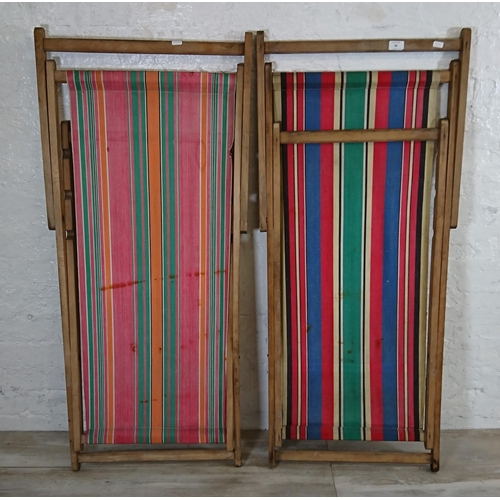 88 - Two mid 20th century beech and fabric folding sun loungers