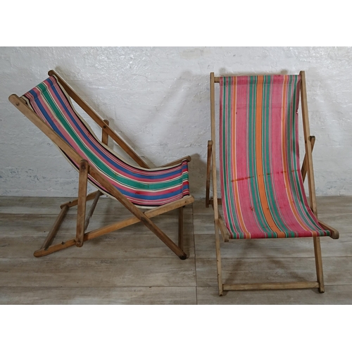 88 - Two mid 20th century beech and fabric folding sun loungers