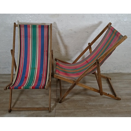 88 - Two mid 20th century beech and fabric folding sun loungers