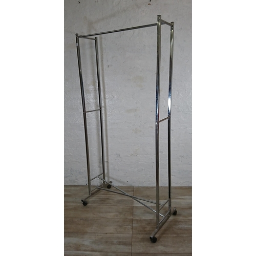 90 - A chrome plated clothes rail on castors - approx. 173cm high x 86cm wide x 47cm deep