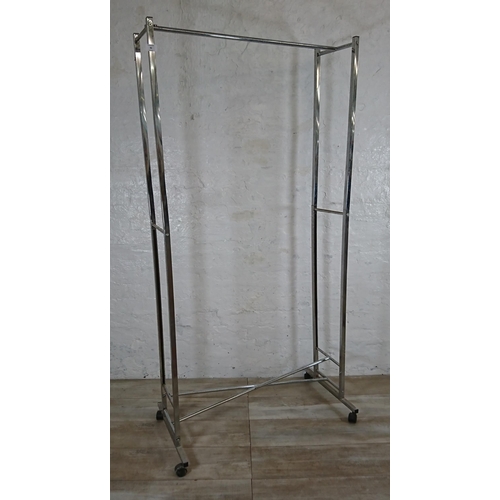 90 - A chrome plated clothes rail on castors - approx. 173cm high x 86cm wide x 47cm deep