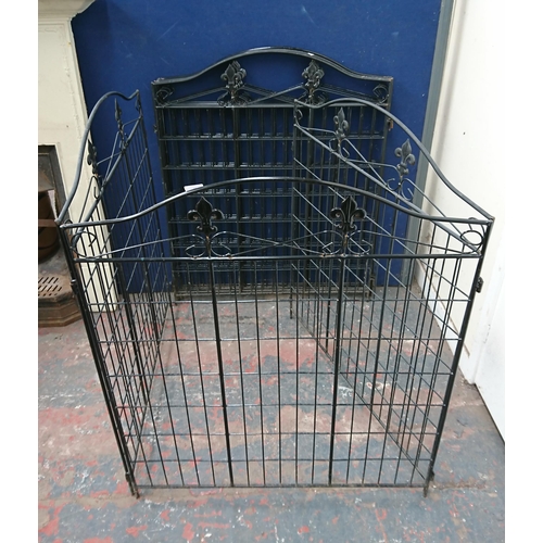 92 - Eight black metal garden gates - approx. 113cm high x 92cm wide