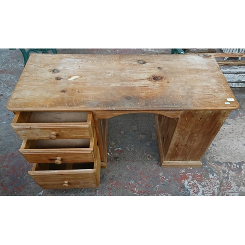 98A - A Victorian style pine three drawer pedestal desk - approx. 74cm high x 130cm wide x 52cm deep