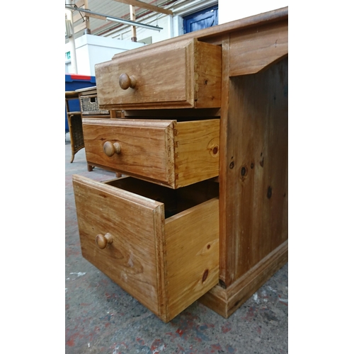 98A - A Victorian style pine three drawer pedestal desk - approx. 74cm high x 130cm wide x 52cm deep