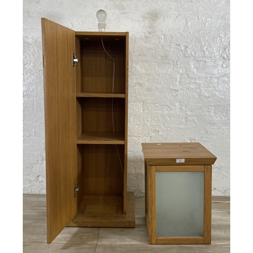 151 - A modern oak illuminating cabinet - approx. 149cm high x 40cm wide x 40cm deep