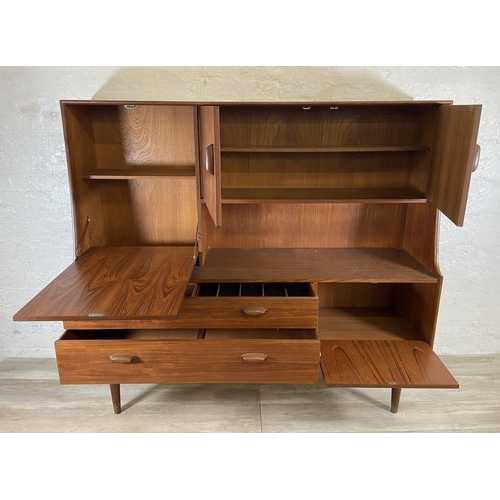 153 - A mid 20th century G Plan Brasilia teak highboard - approx. 136cm high x 152cm wide x 44cm deep