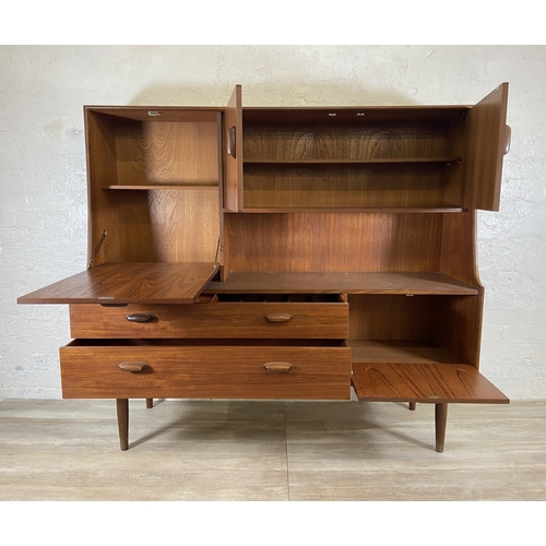 153 - A mid 20th century G Plan Brasilia teak highboard - approx. 136cm high x 152cm wide x 44cm deep