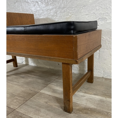 154 - A mid 20th century teak telephone table with black vinyl cushion - approx. 54cm high x 100cm wide x ... 