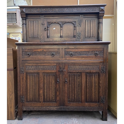 160 - A 17th century style carved oak court cupboard - approx. 153cm high x 121cm wide x 48cm deep