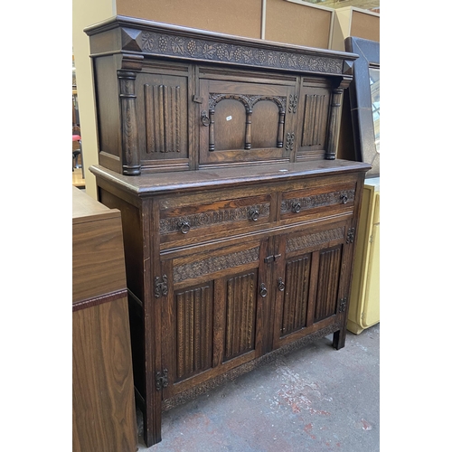 160 - A 17th century style carved oak court cupboard - approx. 153cm high x 121cm wide x 48cm deep