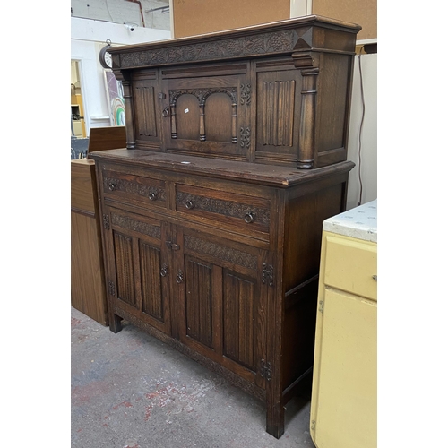 160 - A 17th century style carved oak court cupboard - approx. 153cm high x 121cm wide x 48cm deep