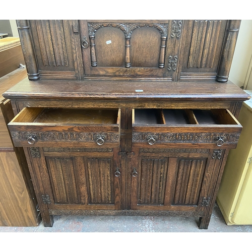 160 - A 17th century style carved oak court cupboard - approx. 153cm high x 121cm wide x 48cm deep