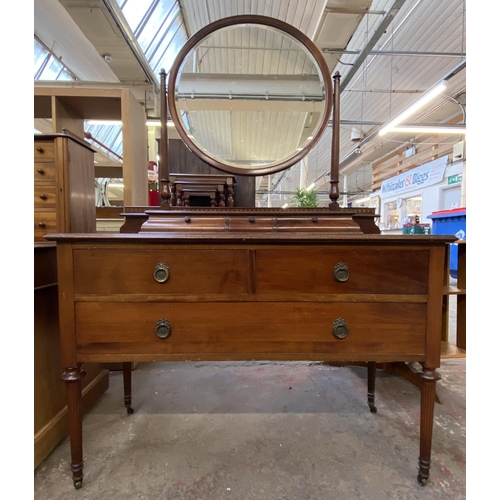 162 - An Edwardian inlaid mahogany dressing table on tapering supports with upper circular bevelled edge m... 