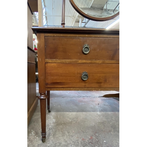 162 - An Edwardian inlaid mahogany dressing table on tapering supports with upper circular bevelled edge m... 