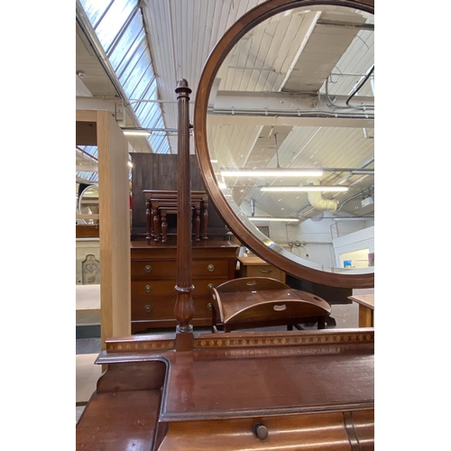 162 - An Edwardian inlaid mahogany dressing table on tapering supports with upper circular bevelled edge m... 