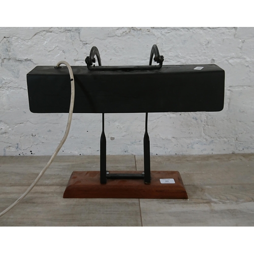 163 - A mid 20th century black painted desk lamp in mahogany plinth - approx. 39cm high x 35cm wide