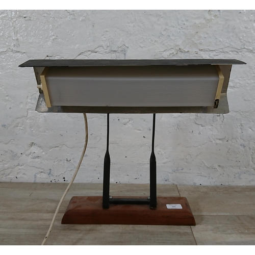 163 - A mid 20th century black painted desk lamp in mahogany plinth - approx. 39cm high x 35cm wide