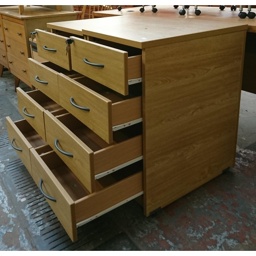 167 - Three office filing cabinets, two oak effect four drawer and one beech effect three drawer