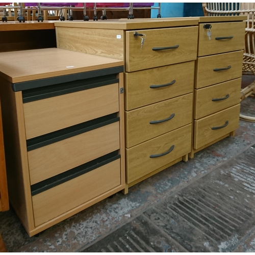 167 - Three office filing cabinets, two oak effect four drawer and one beech effect three drawer