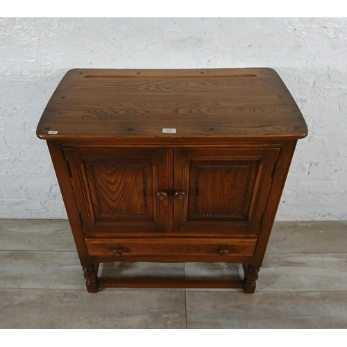 171 - An Ercol Golden Dawn elm credence cupboard/side cabinet - approx. 88cm high x 79cm wide x 42cm deep