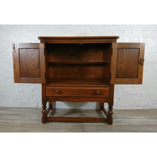 171 - An Ercol Golden Dawn elm credence cupboard/side cabinet - approx. 88cm high x 79cm wide x 42cm deep