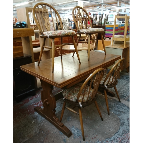 173 - An Ercol Golden Dawn elm draw leaf dining table and four Fleur De Lys chairs - table approx. 75cm hi... 