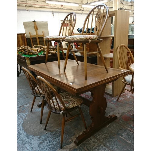 173 - An Ercol Golden Dawn elm draw leaf dining table and four Fleur De Lys chairs - table approx. 75cm hi... 