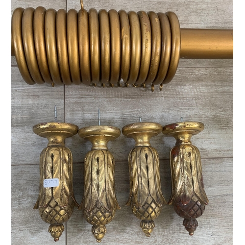 174 - Three Rococo style gilt plaster curtain poles with six brackets, four tie backs and two further meta... 