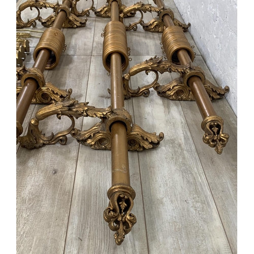 174 - Three Rococo style gilt plaster curtain poles with six brackets, four tie backs and two further meta... 