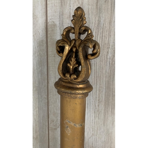 174 - Three Rococo style gilt plaster curtain poles with six brackets, four tie backs and two further meta... 