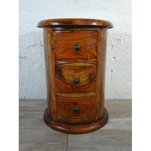 176 - An Indian sheesham wood circular chest of drawers - approx. 56cm high x 44cm diameter