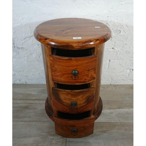 176 - An Indian sheesham wood circular chest of drawers - approx. 56cm high x 44cm diameter