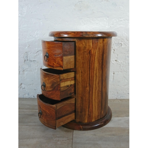 176 - An Indian sheesham wood circular chest of drawers - approx. 56cm high x 44cm diameter