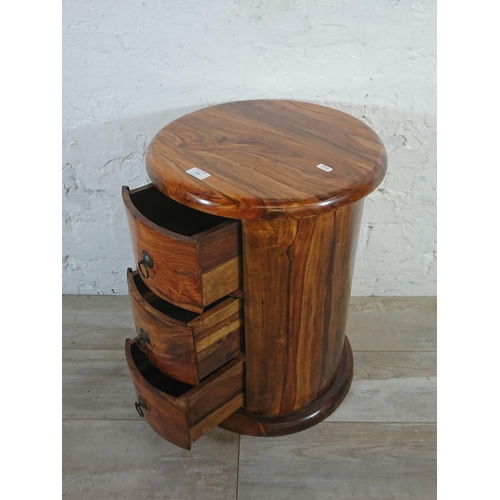 176 - An Indian sheesham wood circular chest of drawers - approx. 56cm high x 44cm diameter