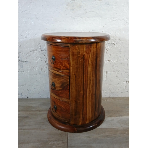 176 - An Indian sheesham wood circular chest of drawers - approx. 56cm high x 44cm diameter