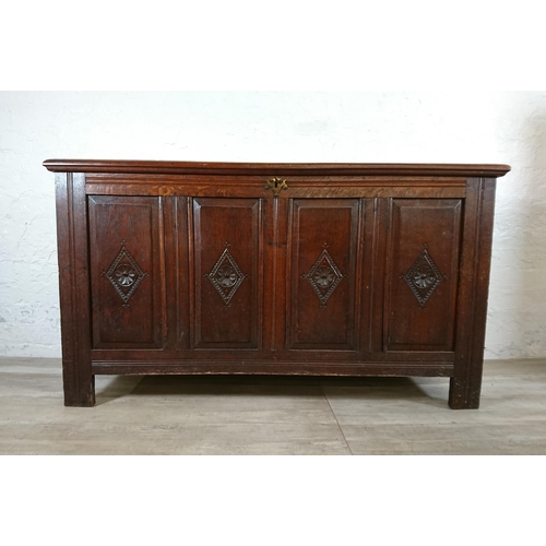 178 - An 18th century and later carved oak four panel coffer - approx. 74cm high x 131cm wide x 49cm deep